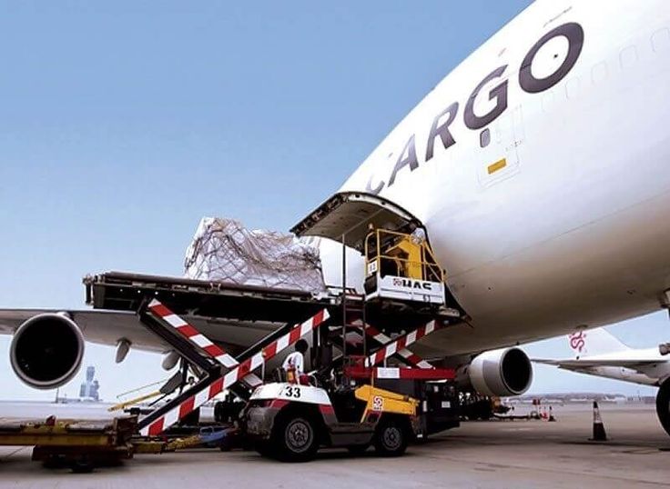 Cargo plane being loaded for fast air freight delivery